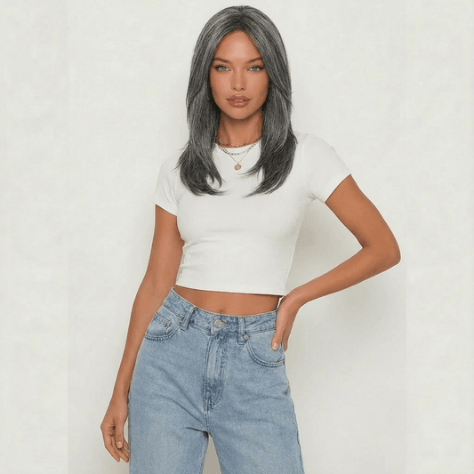 Dark grey layered wig modeled by a woman in a cropped white tee and high-waisted jeans, showcasing elegant style.