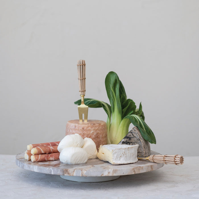 The CREATIVE COOP MARBLE LAZY SUSAN features a round, flat design with light brown and beige veining, displayed on a white background. Its slightly raised base creates an elegant elevated look—perfect as a kitchen centerpiece for entertaining.