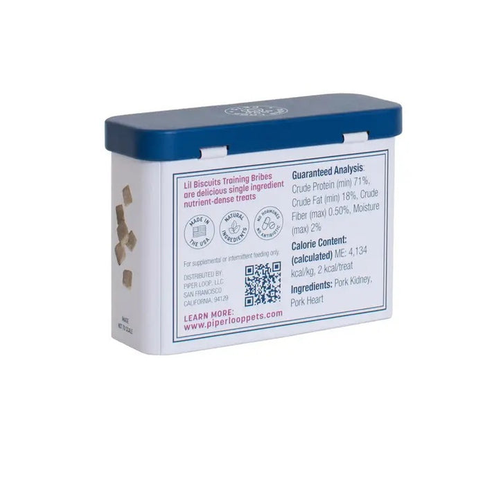 A rectangular white tin with a blue lid labeled "PIPER LOOP PETS - LIL BISCUIT TRAINING BRIBES, FREEZE-DRIED PORK" features a suited dog and promotes freeze-dried pork treats, ideal for training rewards or emergency recalls.