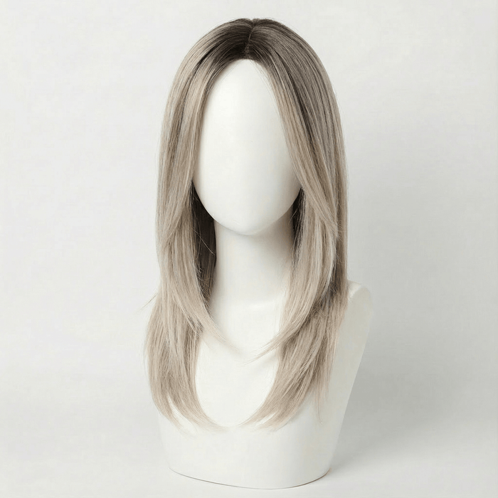 Sofia blonde layered wig with balayage showcasing a natural style with neutral brown roots and creamy blonde ends.