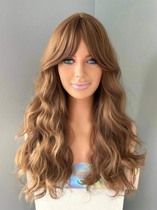 Long brown curly wig with fringe displayed on a mannequin, featuring rich chocolate tones and loose flowing curls.