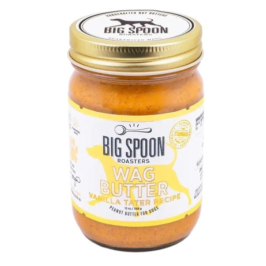 BIG SPOON ROASTERS WAG BUTTER VANILLA TATER is a handmade nut and peanut butter for dogs, with a gold lid and white label with yellow accents and a dog silhouette—an irresistible treat from BIG SPOON ROASTERS.