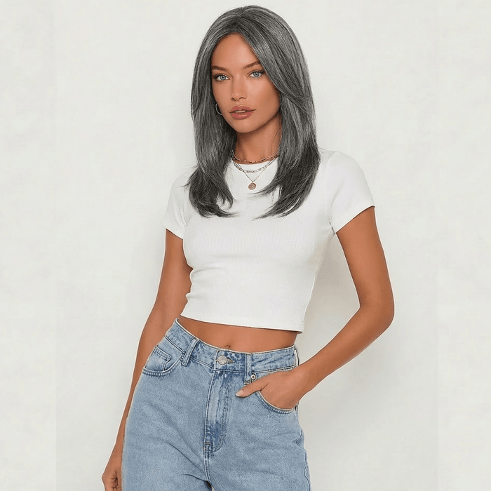 Model showcasing the Dixie dark grey layered wig, featuring a stylish shoulder-length cut and cool-toned ash shade.