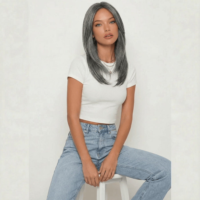 Dixie Dark Grey Layered Wig worn by a model, featuring cool-toned ash grey color and shoulder-length layers.