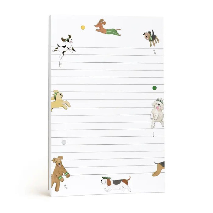 E. FRANCES PAPER's NOTEPAD OFF LEASH features lined pages with playful dog and ball illustrations along the edges, making it a perfect stationery gift for dog lovers or pet parents—ample space provided for your notes.