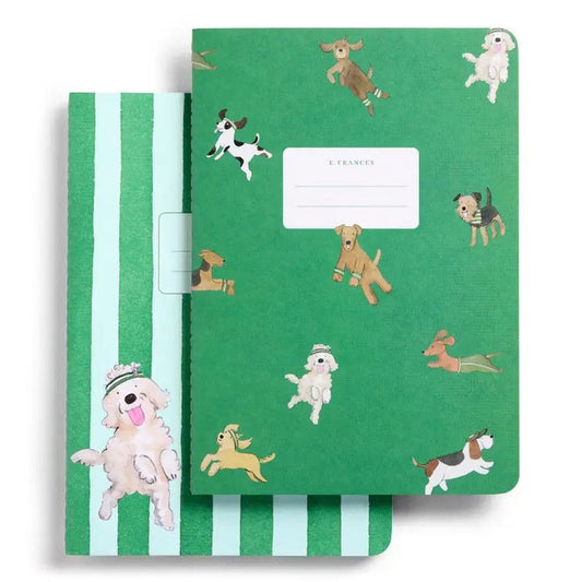 The E. FRANCES - STITCHED NOTEBOOKS OFF LEASH, SET OF 2 by E. FRANCES PAPER features one notebook with green stripes and a dog illustration, and another adorned with playful pups—perfect for pet lovers’ stationery needs.