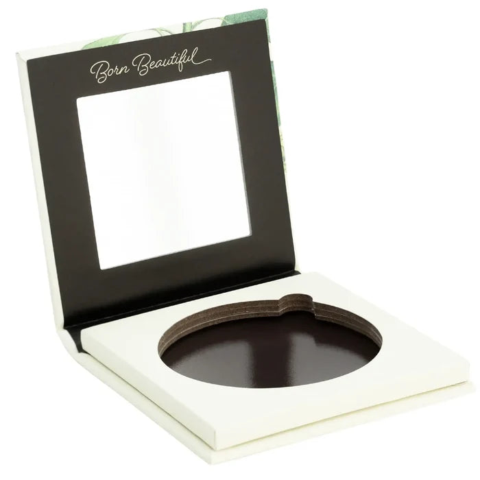 Makeup compact with mirror and brown powder, branded 'Born Beautiful', on a white background