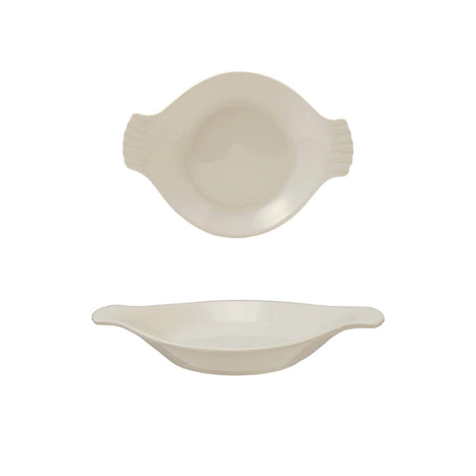 A flat lay featuring the HALF-CUP STONEWARE BAKER by CREATIVE COOP alongside ceramic dishes, bowls, a jug, dried flowers, garlic bulbs, seasonings, and an artichoke on a beige surface. The ceramics showcase earthy hues and organic shapes.