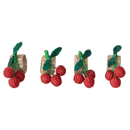 The CREATIVE COOP HAND-WOVEN SEAGRASS CHERRY NAPKIN RINGS, SET OF 4, feature clusters of red cherries and green leaves—ideal as handcrafted table decor and arranged beautifully on any setting.