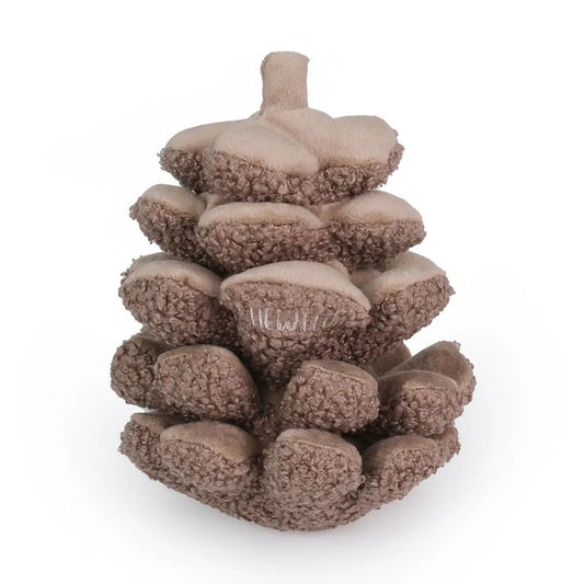 The CHEWFFON PINECONE SNUFFLE & CRINKLE DOG TOY is a plush dog toy shaped like a brown pine cone, featuring a textured surface and a small embroidered label. Designed to promote dental hygiene while keeping your pup entertained, it is photographed on a plain white background.
