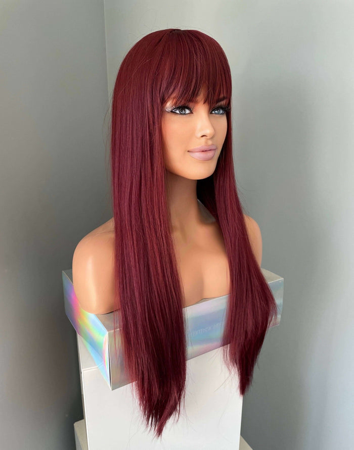 long wine red silky straight wig with bangs displayed on a mannequin bust