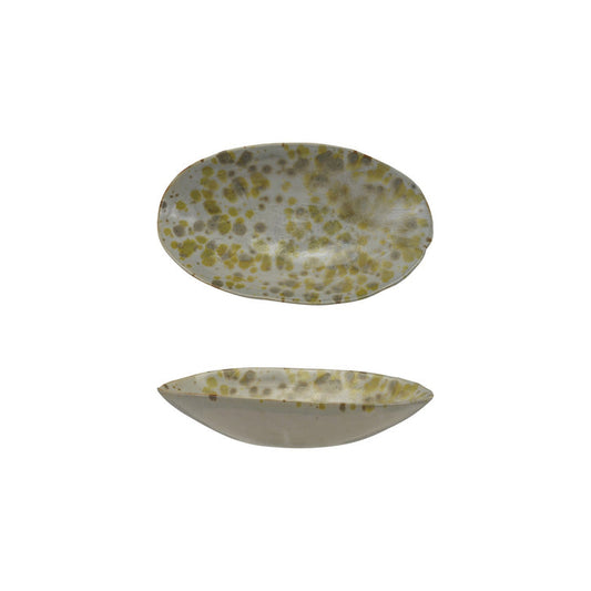 The CREATIVE COOP STONEWARE DISH features an oval ceramic design with a white base and yellow-green speckles from a reactive glaze. Shown top and side, these unique pieces add handcrafted charm to your kitchen decor.