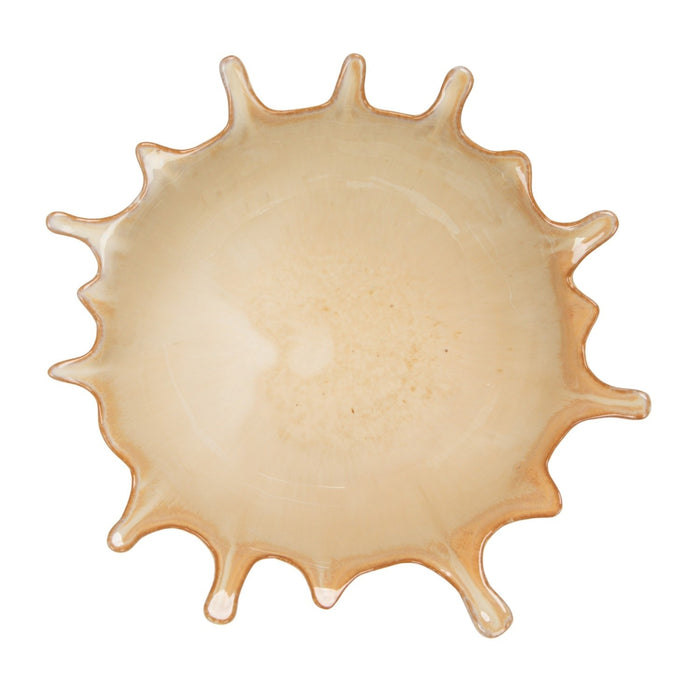 The CREATIVE COOP STONEWARE SUNBURST BOWL features wavy, irregular edges and a striking sunburst design in light neutral tones, shown here as two bowls—one viewed from the side, one from above.